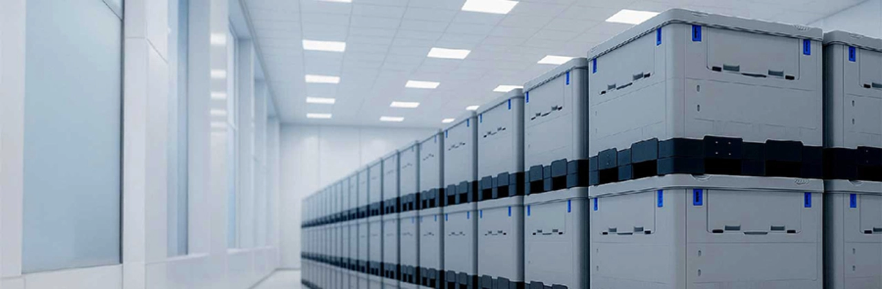 Stacks of thermoplastic biopharma totes in a warehouse render.